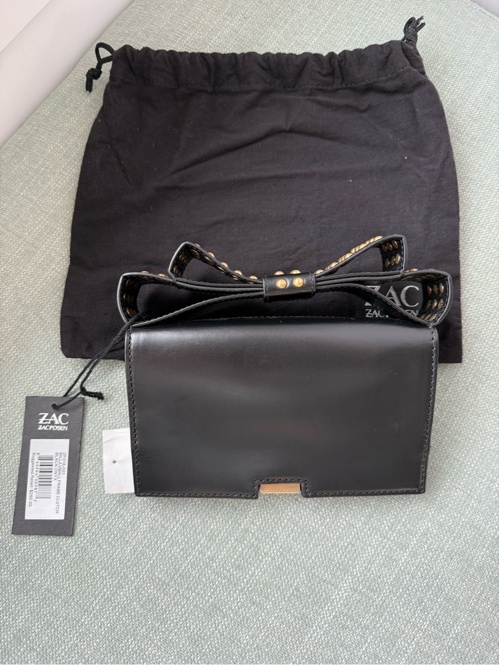 ZAC Zac Posen Black Leather Clutch with Bow-Accent Riveted Strap